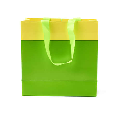 Green shopping or gift bag isolated over the white backgroundの写真素材
