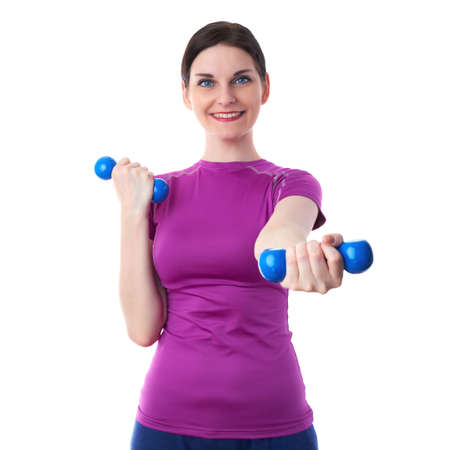 Smiling sporty woman in violet T-short doing exercises with blue dumbbells over white isolated background, fitness, sport and lifestyle conceptの写真素材