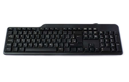 Black computer querty keyboard isolated over white backgroundの写真素材
