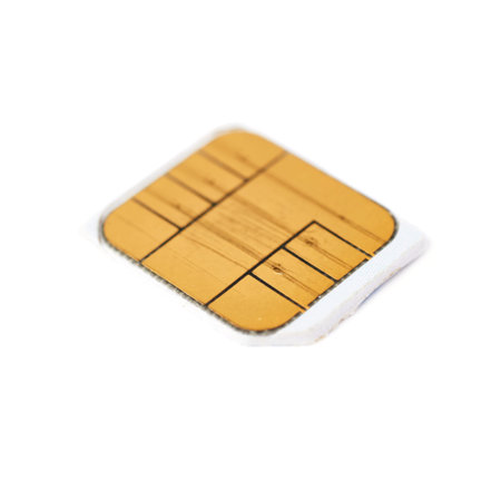 Used scratched credit card chip macro isolated over white backgroundの写真素材