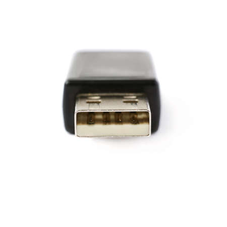 Black flash drive or wireless receiver isolated over white backgroundの写真素材