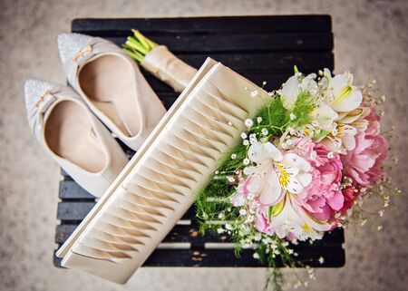 Wedding shoes, bag and bouquetの写真素材