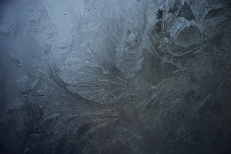 Blue frosting window with ice on itの写真素材