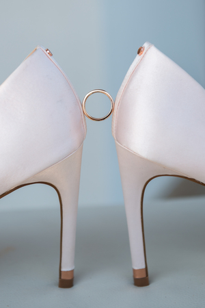 White shoes and ring of the Bride . wedding theme backgroundの写真素材