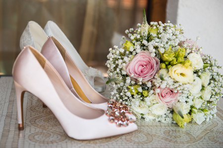 White shoes and ring of the Bride . wedding theme backgroundの写真素材