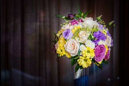 Yellow and pink wedding bouquet from rosesの写真素材