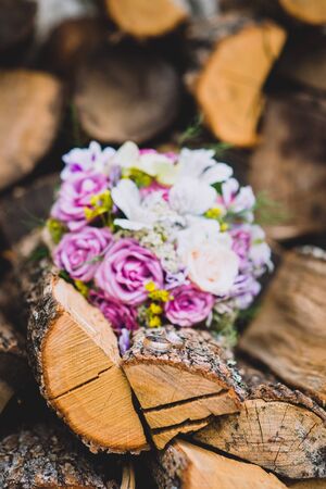 Beautiful wedding colorful bouquet for bride. Beauty of colored flowers. Close-up bunch of florets. Bridal accessories. Female decoration for girl. Details for marriage and for married coupleの写真素材