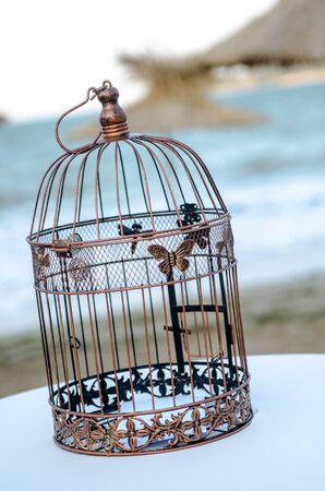 Vintage lantern. Wedding decoration in front of the sea. Close upの写真素材