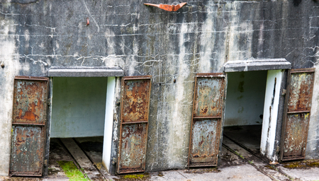 Rusty Iron doors on a concrete wallの写真素材
