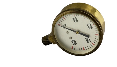Antique vintage brass pressure gauge with threaded pipe fitting on a white backgroundの写真素材