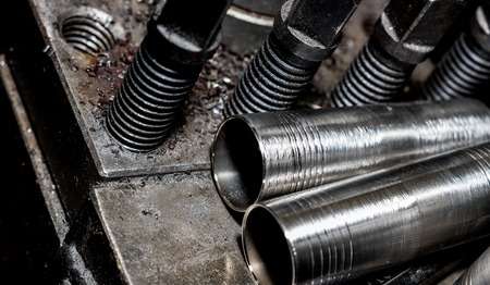 Vintage antique automotive machine shop brake cylinder stainless steel sleeves on machineの写真素材