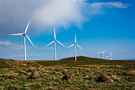 Wind Farm with cloudy blue skyの写真素材