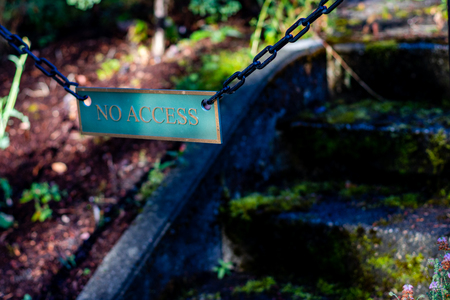 No access sign on moss covered concrete stairs with shadowsの写真素材