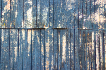 Old distressed painted chipped white wall with lines and shadowsの写真素材