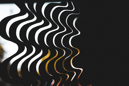 Abstract wavy metal close up with trees in the distanceの写真素材