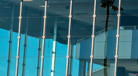 Abstract building window glass with blue sky and reflection