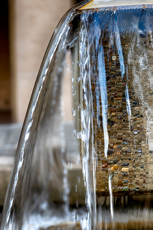 Abstract water fountain close up view with concrete structureの写真素材