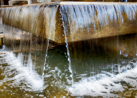 Abstract water fountain close up view with concrete structureの写真素材