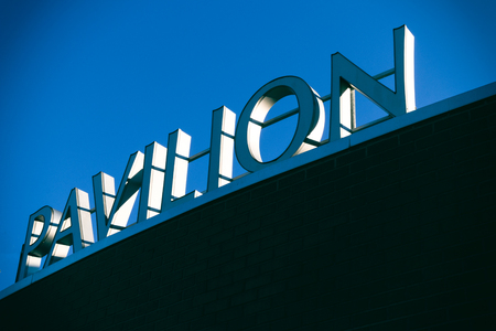 Modern building sigh with words pavilion and blue skyの写真素材