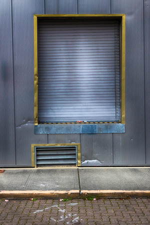 Warehouse loading dock with garage door in daylightの写真素材