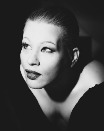 Classic timeless elegant model posing for vintage shoot in black and whiteの写真素材