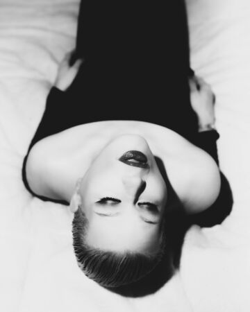 Classic timeless elegant model posing for vintage shoot in black and whiteの写真素材
