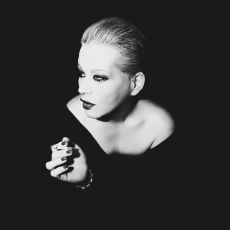 Classic timeless elegant model posing for vintage shoot in black and whiteの写真素材