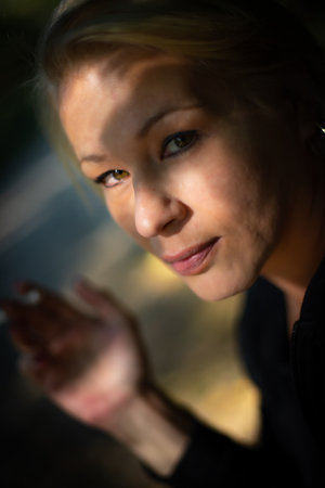 Pretty blonde woman on the city streets posingの写真素材