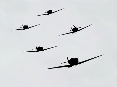 illustration of bomber airplane in silhouette over cloudy sky 