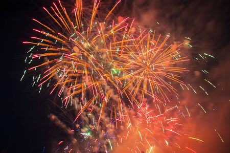 Colorful fireworks over dark sky, displayed during a celebration in Novomoskovskの写真素材