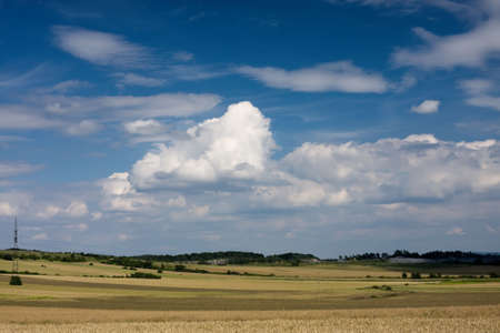Clouds in the sky over the meadowの写真素材