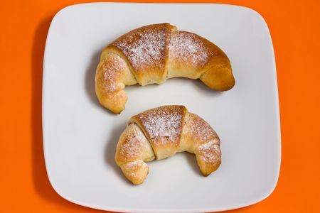 Croissant with jam and sprinkled with sugarの写真素材