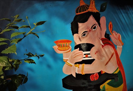Lord ganesh hindu religious god holding shivlinga with both handのeditorial素材