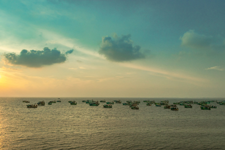 Fishing Boats anchored in sea at morning sunrise with awesome sky contrast.の写真素材