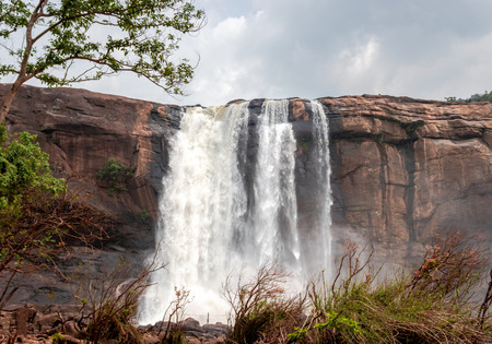 This is the athirapally waterfall kerala india from down angle view. It is falling from 80 mtrs high hill and it is the second largest waterfall in india.の写真素材