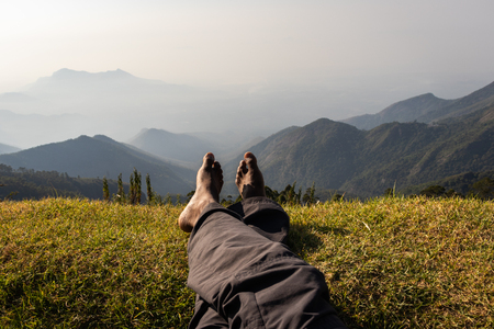 Human love of Nature image is showing the human love towards the nature. The thought of one explorer who truly love the the nature. Image taken at Kodaikanal tamilnadu India from top of the hill.の写真素材