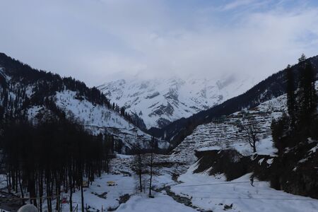Snow at hills with tree and sky image is taken at manali india showing it amazing natural view.の写真素材