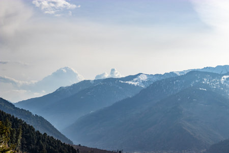 Snow at hills with tree and sky image is taken at manali india showing it amazing natural view.