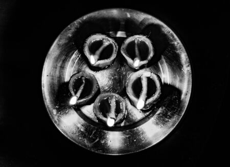 traditional religious soil made oil lamp many lightened for almighty godの写真素材