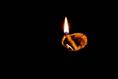 traditional religious soil made oil lamp isolated lightened for almighty godの写真素材