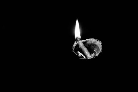 traditional religious soil made oil lamp isolated lightened for almighty godの写真素材
