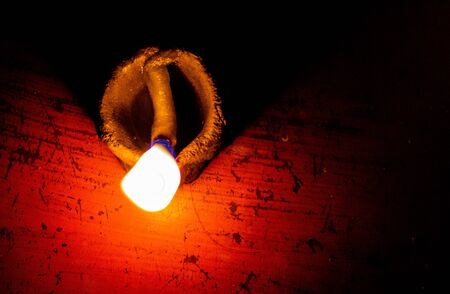 traditional religious soil made oil lamp isolated lightened for almighty godの写真素材
