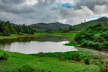 lake pristine with mountain water reflection at morning image is taken at south india. it is showing the beautiful landscape of south india.の写真素材