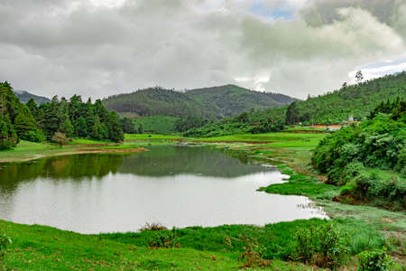 lake pristine with mountain water reflection at morning image is taken at south india. it is showing the beautiful landscape of south india.の写真素材