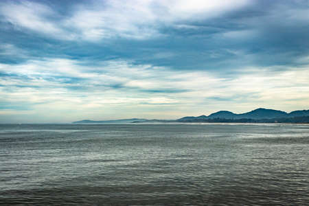 sea horizon at early in the morning from flat angle image is taken at early morning. it is showing the beautiful seascape of nature.の素材 [FY310154585109]