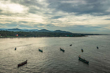 fishing boats in the sea aerial shots at early morning image is take at murdeshwar karnataka india at early morning. it is the very holy as well as touristic place in karnataka.の写真素材