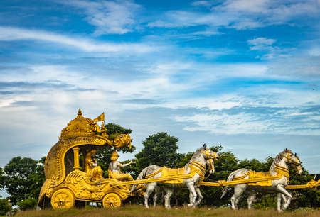 holly Arjuna chariot of Mahabharata in golden color with amazing sky background image is taken at murdeshwar karnataka india.の写真素材