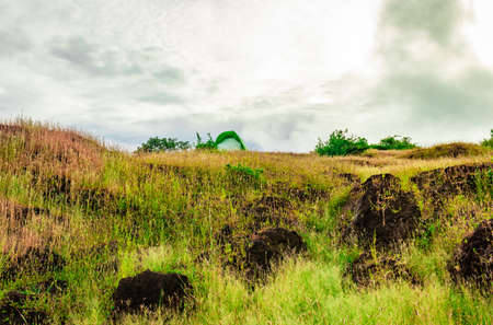 camping solo at mountain top with dramatic sky image is taken at gokarna karnataka india.の写真素材