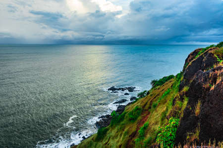 sea horizon view with dramatic cloud from mountain top image is taken at gokarna karnataka india.の写真素材