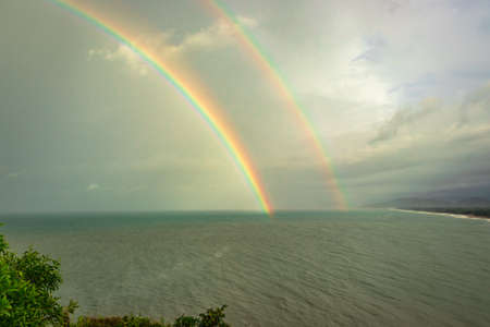 rainbow colorful above sea horizon at dawn image is taken at gokarna karnataka india. it is showing the colorful art of nature.の写真素材